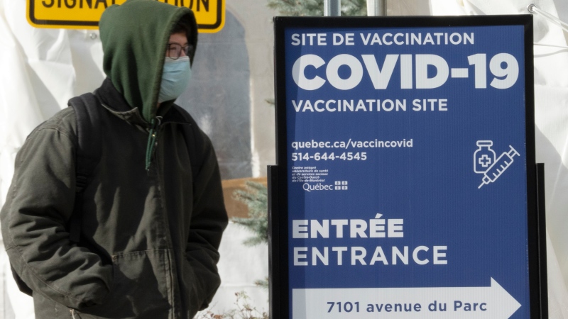 A man enters a COVID-19 vaccination site Wednesday, December 1, 2021 in Montreal. Quebec is reporting 1966 new COVID-19 cases in the past twenty-four hours.THE CANADIAN PRESS/Ryan Remiorz 