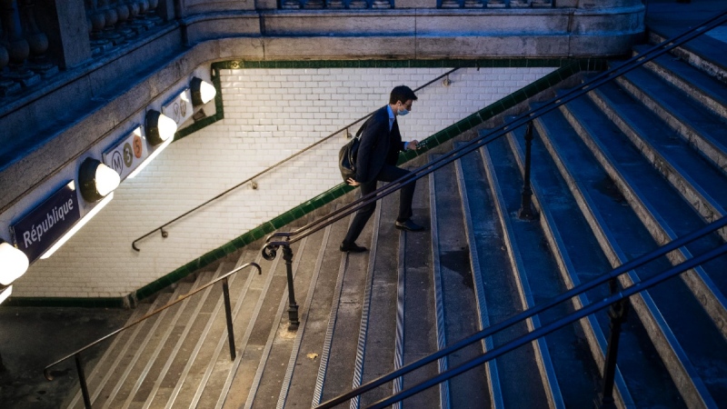 A man wearing a protective mask goes out of Republique's square subway station, in Paris, on Oct. 29, 2020. (Lewis Joly / AP) 
