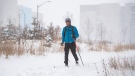 A person cross-country skis on a path in Ottawa, on Monday, Jan. 17, 2022. A blizzard warning is in effect for the region with Environment Canada predicting between 25 to 40 cm of snow. (Justin Tang /THE CANADIAN PRESS)