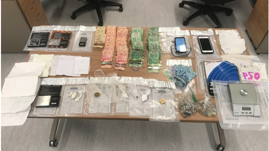 Police display evidence allegedly seized during a search warrant in Orillia, Ont., on Fri., Jan. 14, 2022 (Supplied)