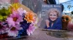 Flowers, stuff toys and cards are displayed at the Hollywood Walk of Fame star of the late actress Betty White, on Dec. 31, 2021. (Ringo H.W. Chiu / AP) 