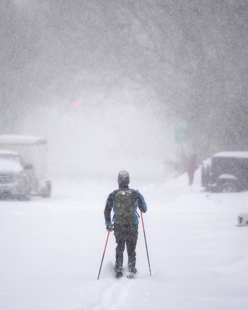 A cross-country skier makes their way up a snow-covered road in Ottawa, on Monday, Jan. 17, 2022. A blizzard warning is in effect for the region with Environment Canada predicting between 25 to 40 cm of snow. THE CANADIAN PRESS/Justin Tang 
