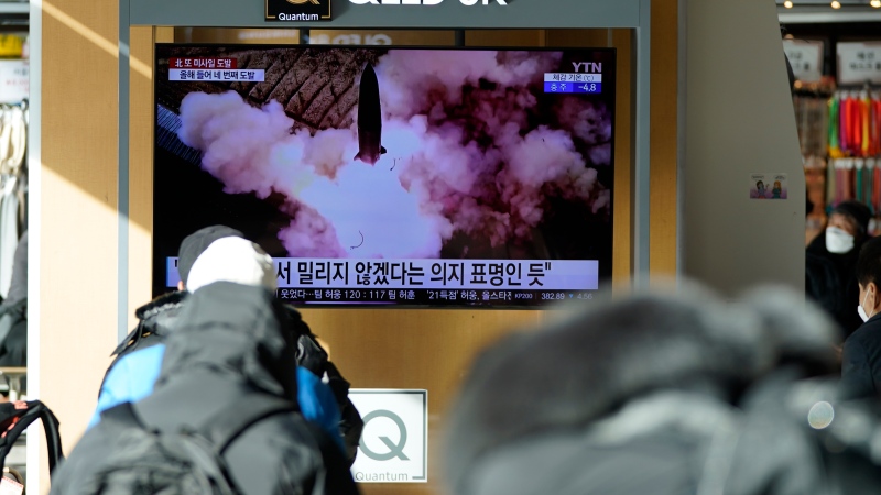 People watch a TV screen showing a news program reporting about North Korea's missile launch with a file image, at a train station in Seoul, South Korea, Monday, Jan. 17, 2022.  (AP Photo/Lee Jin-man) 