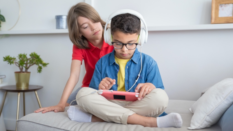 Kids playing video games are seen in this file image. (Pexels) 