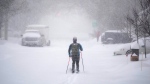 A cross-country skier makes their way up a snow-covered road in Ottawa, on Monday, Jan. 17, 2022. (THE CANADIAN PRESS/Justin Tang )