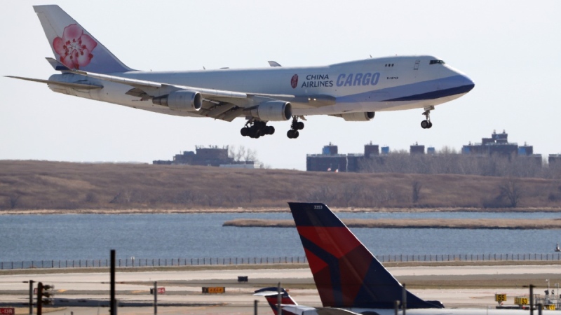 A China Airlines cargo jet lands at John F. Kennedy International Airport, on March 14, 2020. (Kathy Willens / AP) 