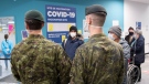 Members of the Canadian Armed Forces are shown at a COVID-19 vaccination site in Montreal, Sunday, January 16, 2022, as the COVID-19 pandemic continues in Canada. THE CANADIAN PRESS/Graham Hughes