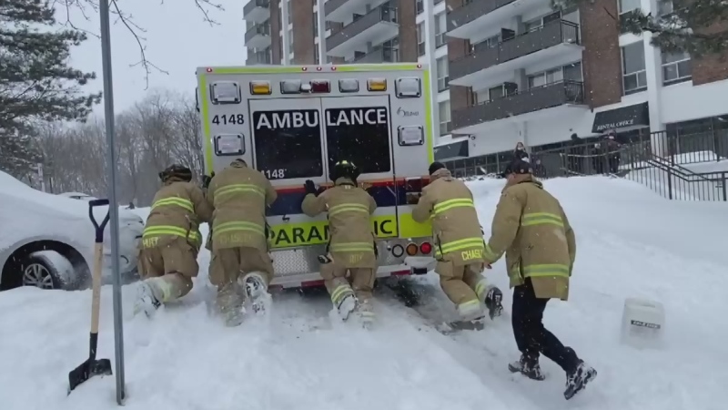 Ottawa firefighters push stuck ambulance