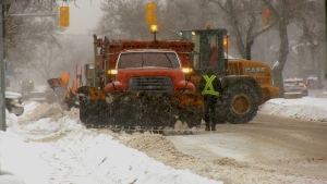 Snow clearing vehicles clear Henderson Highway following a snow storm on January 18, 2022 (CTV News Photo Scott Andersson)