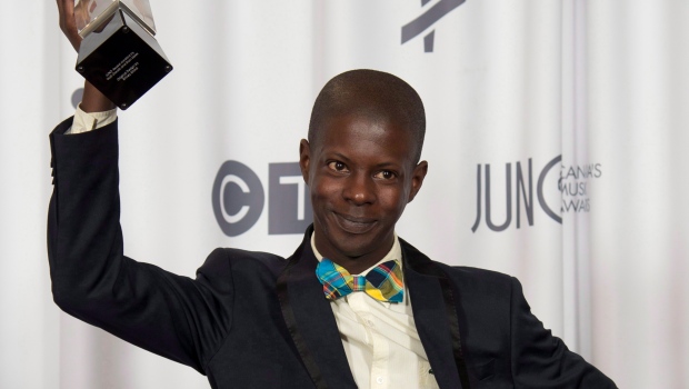 Karim Ouellet celebrates his Juno Award for Francophone Album of the year during the Juno Gala in Winnipeg on Saturday, March 29, 2014. THE CANADIAN PRESS/Jonathan Hayward 