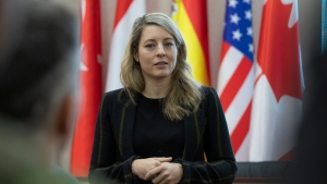 In this photo provided by Ukrainian National Guard Press Office Canada's Minister of Foreign Affairs Melanie Joly speaks during her visit to the National Guard base close to Kyiv, Ukraine, Tuesday, Jan. 18, 2022. (Ukrainian National Guard Press Office via AP) 