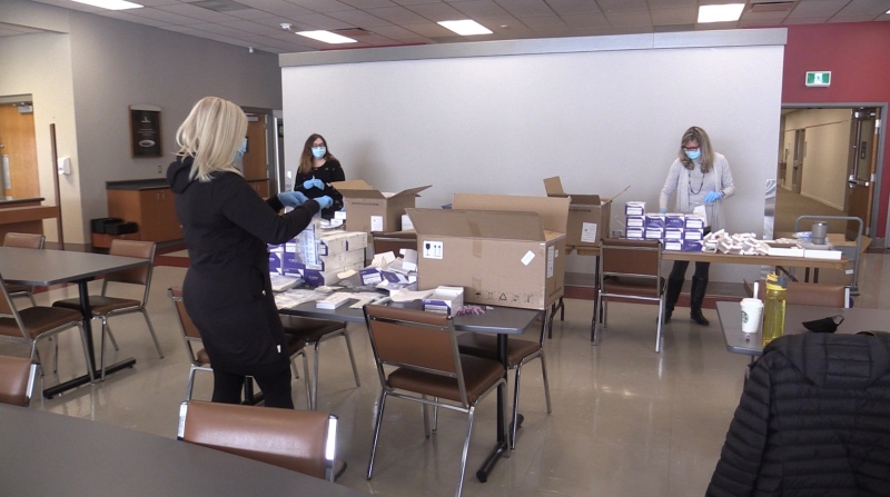 Up to 50 TVDSB staff volunteers in London, Ont. are working to process 146,000 Rapid Test kits in order to get them to students in the region as soon as possible, jan. 18, 2022. (Brent Lale / CTV London)