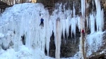 Person climbs down frozen waterfall in Ont.