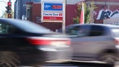 Cars drive by a gas station in Montreal on Oct. 20, 2021. THE CANADIAN PRESS/Paul Chiasson