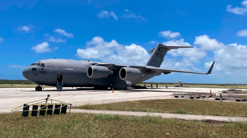 In this photo provided by the Australian Defence Force, a Royal Australian Air Force C-17A Globemaster III aircraft is parked at Fua'amotu International Airport near Nuku'alofa, Tonga, Thursday, Jan. 20, 2022. (Australian Defence Force via AP) 