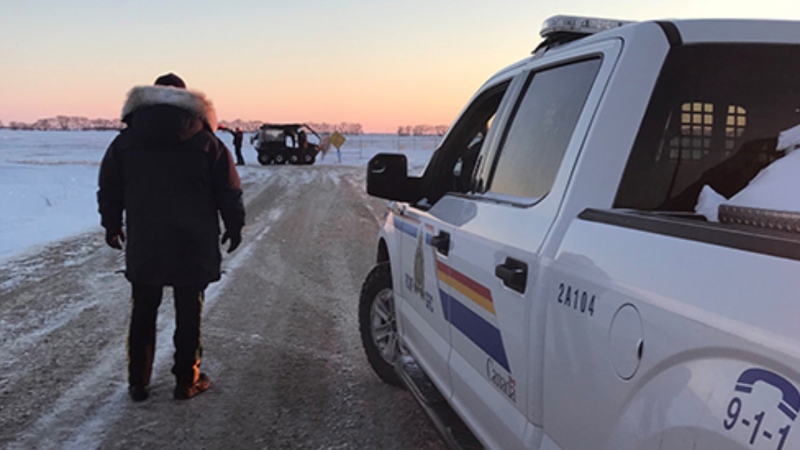 Manitoba RCMP search an area near the Canada-U.S. border on Jan. 19, 2022, where the bodies of four people, including a baby were found. (Source: Manitoba RCMP)
