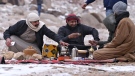 Several recent snow and hailstorms in the region have transformed landscapes in and around Saudi Arabia, stirring excitement among locals and causing a sensation on social media, and pictured, Saudis melt snow for coffee in Jabal al-Lawz near Tabuk. (Ibrahim Assiri/AFP/Getty Images/CNN)