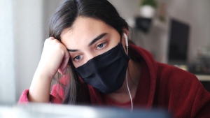 A person wearing a face mask is seen in this undated stock image. (Shutterstock)