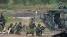 Canadian soldiers attend the NATO military exercises ''Namejs 2021'' at a training ground in Kadaga, Latvia, on Monday, Sept. 13, 2021. NATO responded to Russia's 2014 annexation of Ukraine's Crimean Peninsula by bolstering its forces near Russia and conducting drills on the territory of its Baltic members _ the maneuvers the Kremlin described as a security threat. (AP Photo/Roman Koksarov, File)