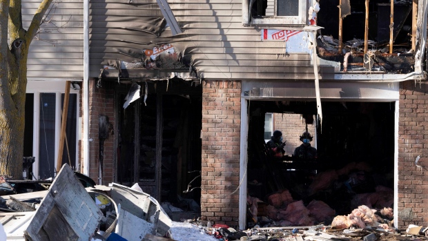 Firefighters are shown at the scene of a fatal house fire in Brampton, Ont., Thursday, Jan.20, 2022. Three boys have died after a house fire in Brampton, Ont. on Thursday morning. THE CANADIAN PRESS/Frank Gunn