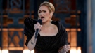 Adele, seen performing during her CBS special, has postponed her Las Vegas residency. (Cliff Lipson/CBS)