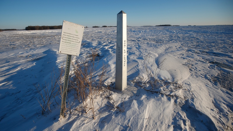 A border marker is shown just outside of Emerson, Man. on Thursday, January 20, 2022. American investigators believe the deaths of four people, including a baby and a teen, whose bodies were found in Manitoba near the United States border are linked to a larger human smuggling operation. THE CANADIAN PRESS/John Woods 