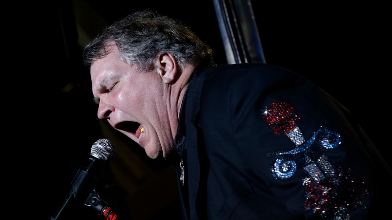 Meat Loaf performs at the football stadium at Defiance High School in Defiance, Ohio, on Oct. 25, 2012. (AP Photo/Charles Dharapak)