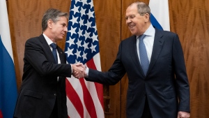 U.S. Secretary of State Antony Blinken, left, shakes hands with Russian Foreign Minister Sergey Lavrov before their meeting in Geneva, on Jan. 21, 2022. (Alex Brandon / AP) 