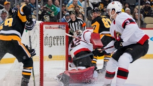 Pittsburgh Penguins captain Sidney Crosby scores a goal against the Ottawa Senators on Thursday, Jan. 20, 2022. (Gene J. Puskar/Associated Press)