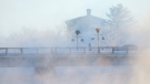 A pedestrian walks through the steam coming off the Mississippi River as temperatures hit -30C in the Ottawa Valley in Carleton Place, Ont., on Friday, Jan. 21, 2022. (Sean Kilpatrick/THE CANADIAN PRESS)