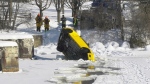 Crews from the Ottawa Police Service, Ottawa Paramedic Service and Ottawa Fire Service removed a car from the Rideau River ice on Friday. (Dave Charbonneau/CTV News Ottawa)
