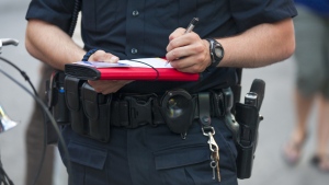 A police officer issues a ticket in this undated image. (Shutterstock)
