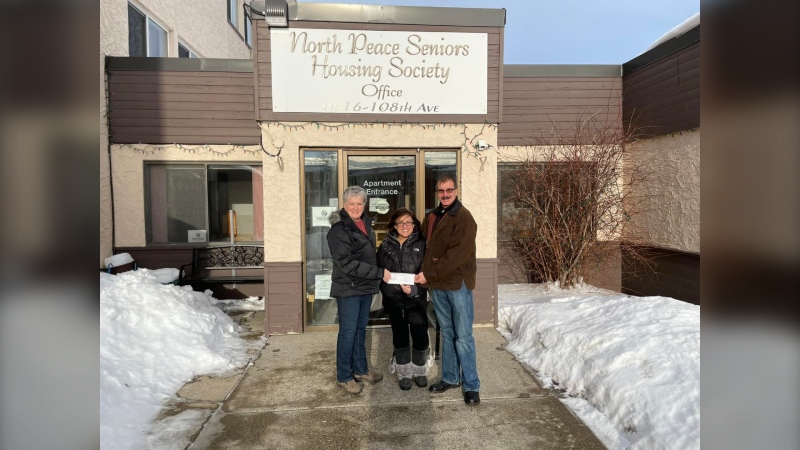 picture of Marshall's presenting donation to North Peace Senior Housing Society, Courtesy Facebook