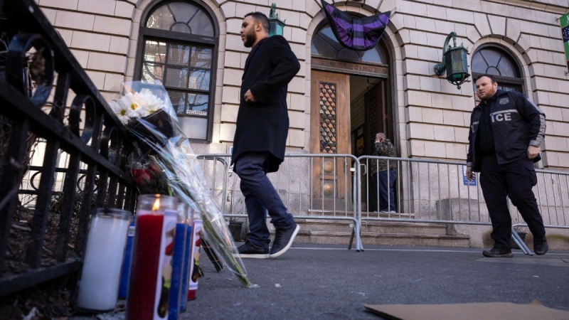 A makeshift memorial is seen outside the NYPD 32nd precinct near the scene of a shooting in Harlem on Jan. 22, 2022, in New York. (AP Photo/Yuki Iwamura)