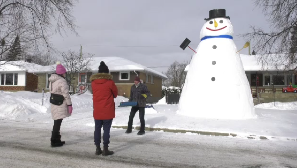Luc Guertin built Waldo, the 18-foot snowman, in front of his Elmvale Acres home. (Jackie Perez/CTV News Ottawa)