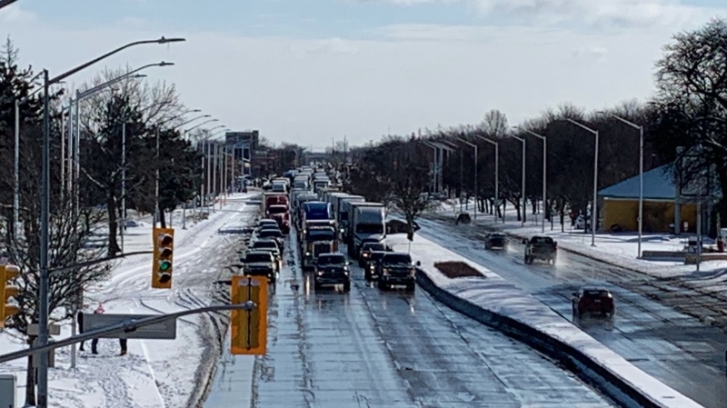 A convoy of thousands of transport truck drivers protesting the federal vaccine mandate for cross-border travel drove through Windsor, Ont. on Sunday, Jan. 23, 2022. (Chris Campbell/CTV Windsor)
