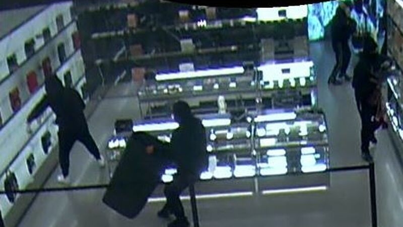 A security camera image shows suspects robbing a store in downtown Toronto on Jan. 10, 2022. (Toronto Police Service)