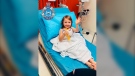 In this photo provided by the Western Australia Police, four-year-old Cleo Smith waves as she sits on a bed in hospital on Nov. 3, 2021, in Carnarvon, western Australia. (Western Australia Police via AP)