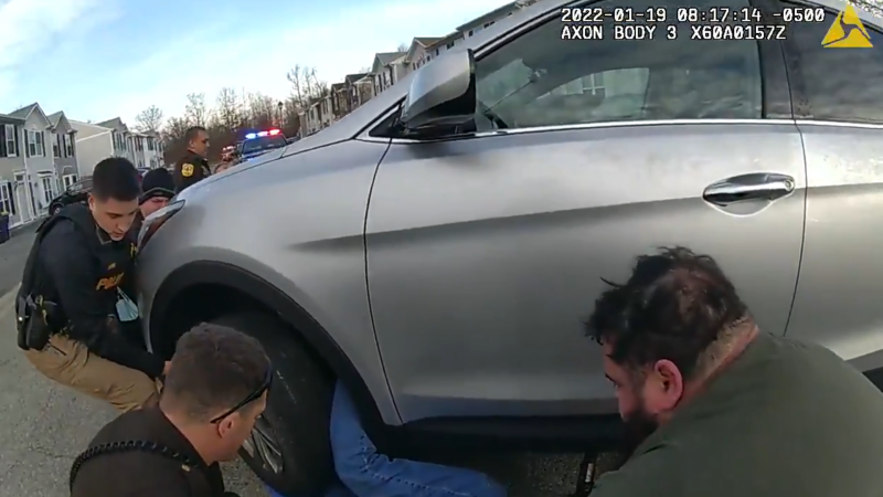 A 70-year-old woman trapped underneath an SUV was freed by Delaware police officers.