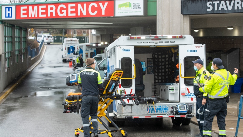 Paramedics and ambulances spill out of the Emergency ramp at Michael Garron Hospital in Toronto on Monday, April 12, 2021. THE CANADIAN PRESS/Frank Gunn 