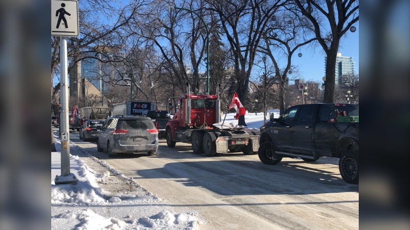 A truck convoy protesting mandatory vaccine mandates runs outside of the Manitoba Legislature in Winnipeg on Jan. 24, 2022 (CTV News Photo Ken Gabel)