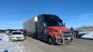 A semi is parked at a Saskatoon truck stop as a protest convoy gets ready to head through the city on Jan. 24, 2022. (Tyler Barrow/CTV News)