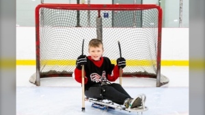 Easton Harris on the ice playing sledge hockey. He was diagnosed with aplastic anemia just after his eighth birthday. (Courtesy Harris family)