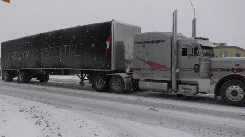 A convoy of  transport truck drivers protesting the federal vaccine mandate for cross-border travel drove through Windsor, Ont. on Sunday, Jan. 24, 2022. (Angelo Aversa/CTV Windsor) 