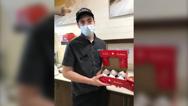 Ryan Misener pictured with the Choose To Include limited edition doughnuts. (Alana Pickrell/CTV News) 