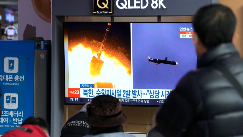 People watch a TV showing file images of North Korea's missile launch during a news program at the Seoul Railway Station in Seoul, South Korea, on Jan. 25, 2022. (AP Photo/Ahn Young-joon)
