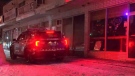 A police vehicle is seen near Dufferin Street after a stabbing incident on Jan. 25, 2022. (CP24)