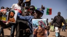 A man holds a portait of Lt. Col. Paul Henri Sandaogo Damiba who has taken the reins of the country in Ouagadougou, on Jan. 25, 2022. (Sophie Garcia / AP)
