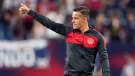 Canada head soccer coach John Herdman salutes the crowd as he leaves the pitch following a 1-1 draw against the United States in a World Cup soccer qualifier on Sept. 5, 2021, in Nashville, Tenn. (AP Photo/Mark Humphrey)