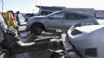 Multiple vehicles are towed to the ONroute parking lot on Highway 400 in Innisfil following several collisions on Tues., Jan. 25, 2022 (STEVE MANSBRIDGE/CTV NEWS)